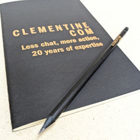 Clementine Com notepad and pencil