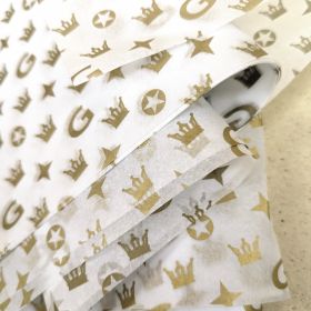 Gold ink on white tissue