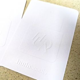 Huda Beauty blind embossed card