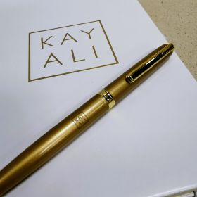 Kayali notebook and pen