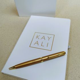 Kayali notebook and pen
