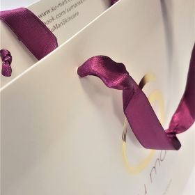 white lam ribbon handles